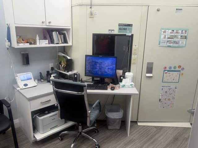 Audiology testing room at Sense of Hearing Etobicoke with a sound-treated booth and hearing assessment equipment