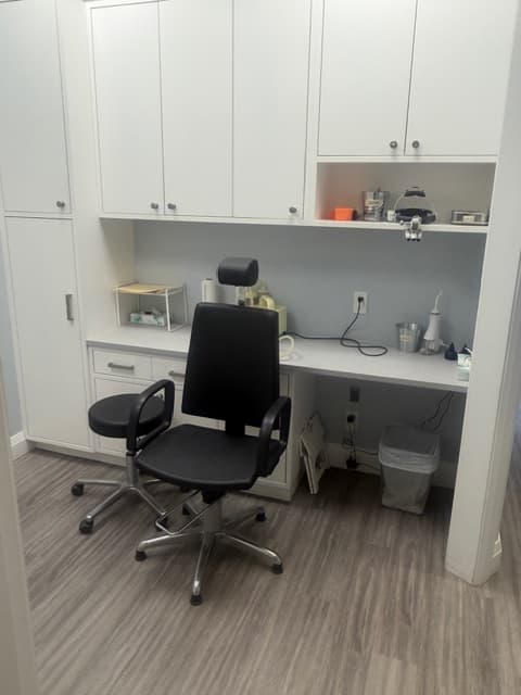 Treatment room at Sense of Hearing Etobicoke with an adjustable chair and earwax removal and fitting equipment