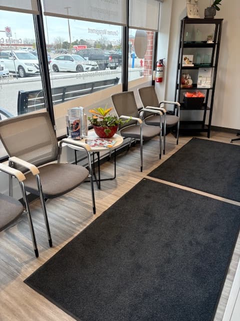 Waiting area at Sense of Hearing Oakville with seating and natural light from the window